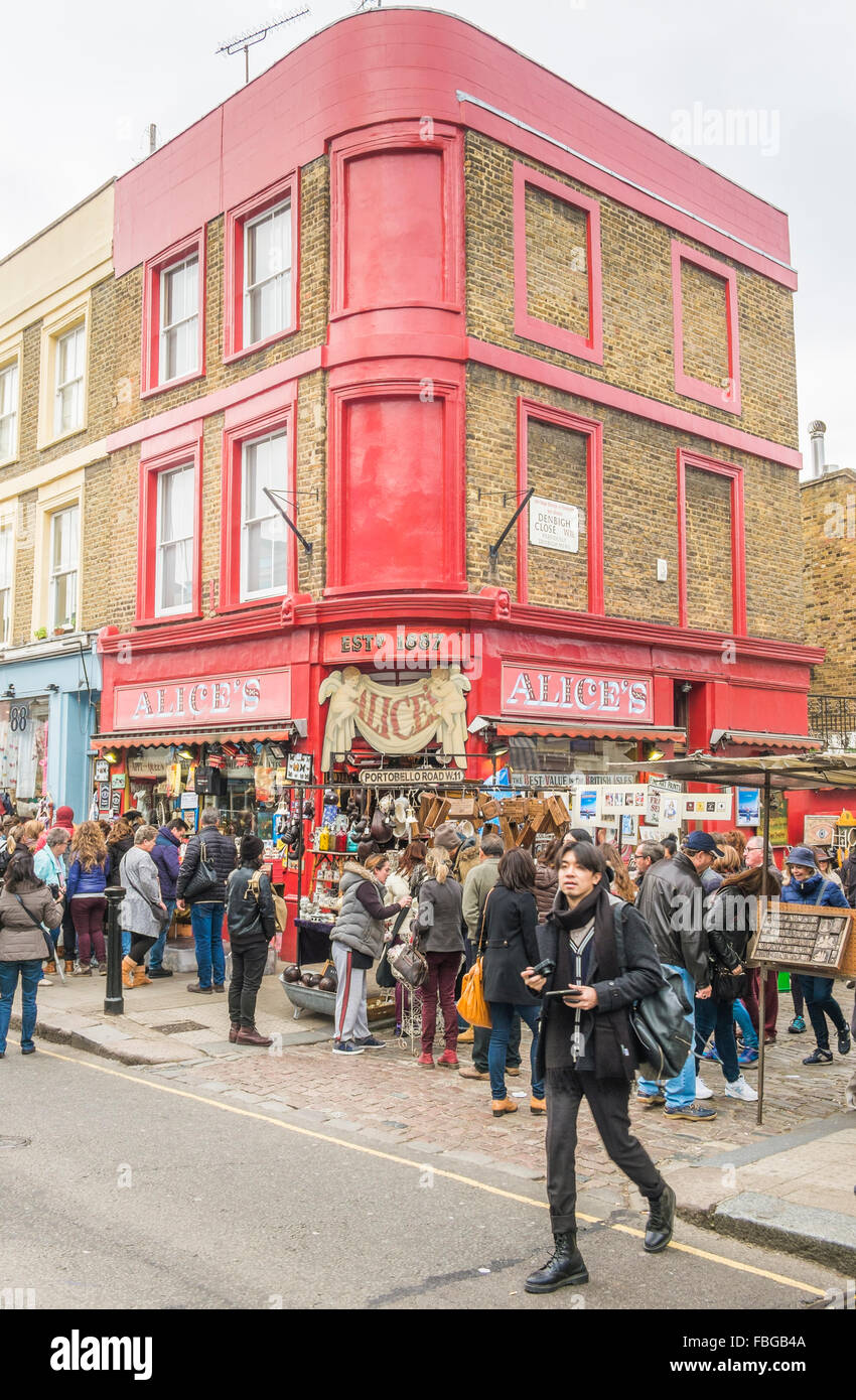 visitors of portobello road market in front of alice´s store