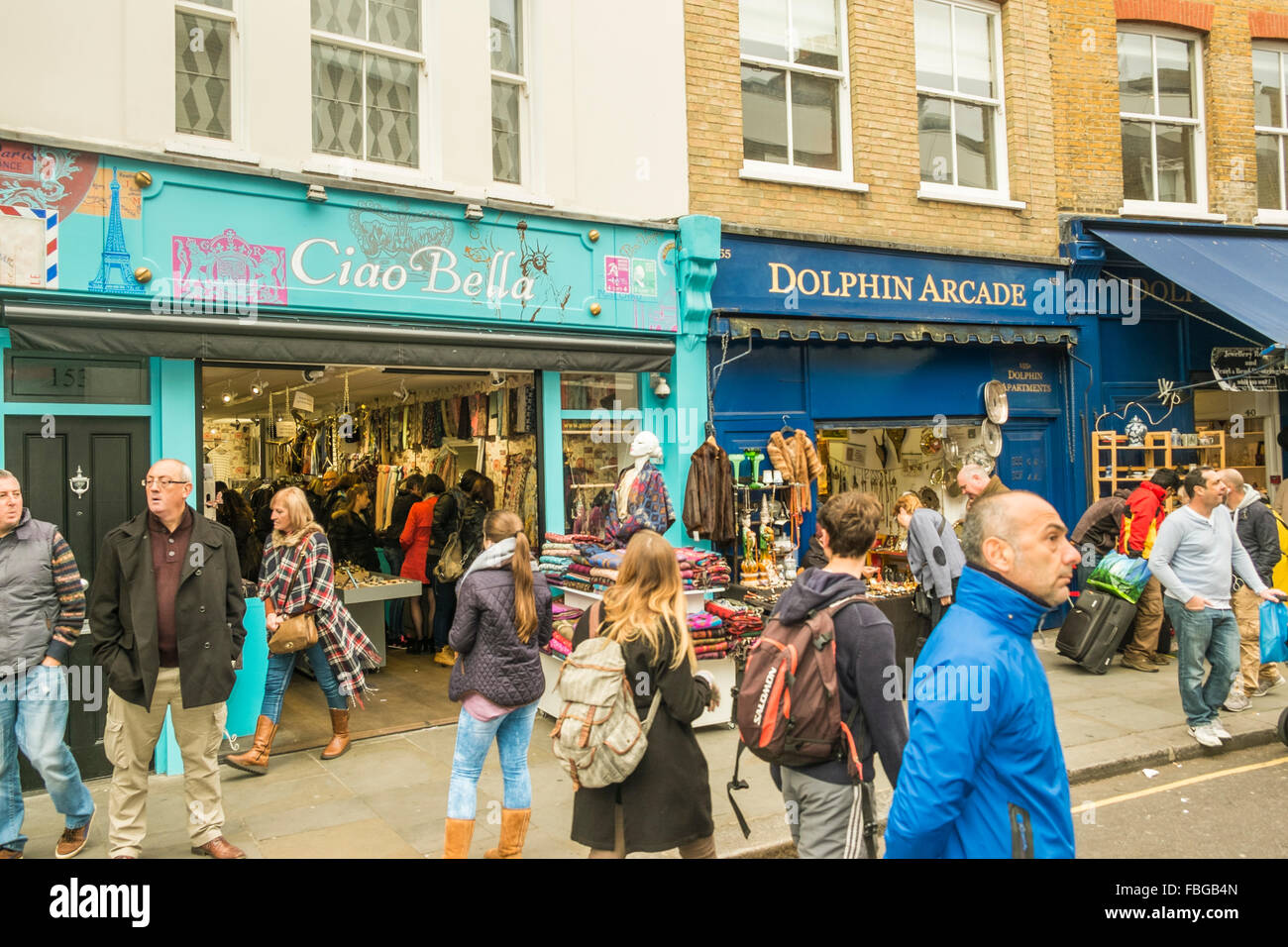 visitors of portobello road market in front of ciao bella and dolpin arcade stores, notting hill, london, england Stock Photo