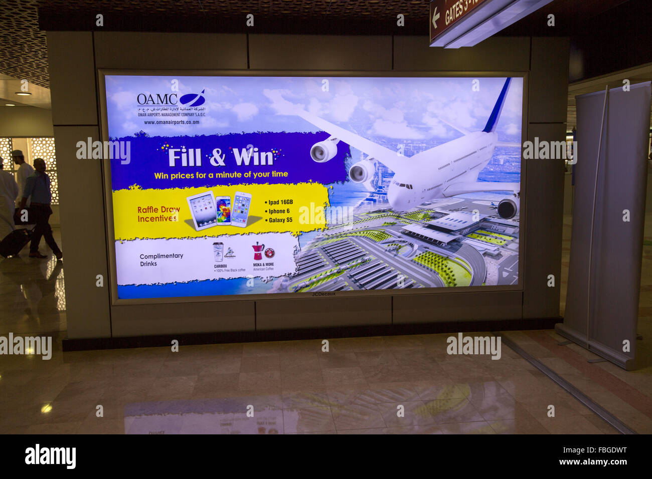 Fill and Win competition electronic advertising billboard, Seeb International Airport, Muscat, Oman, Stock Photo