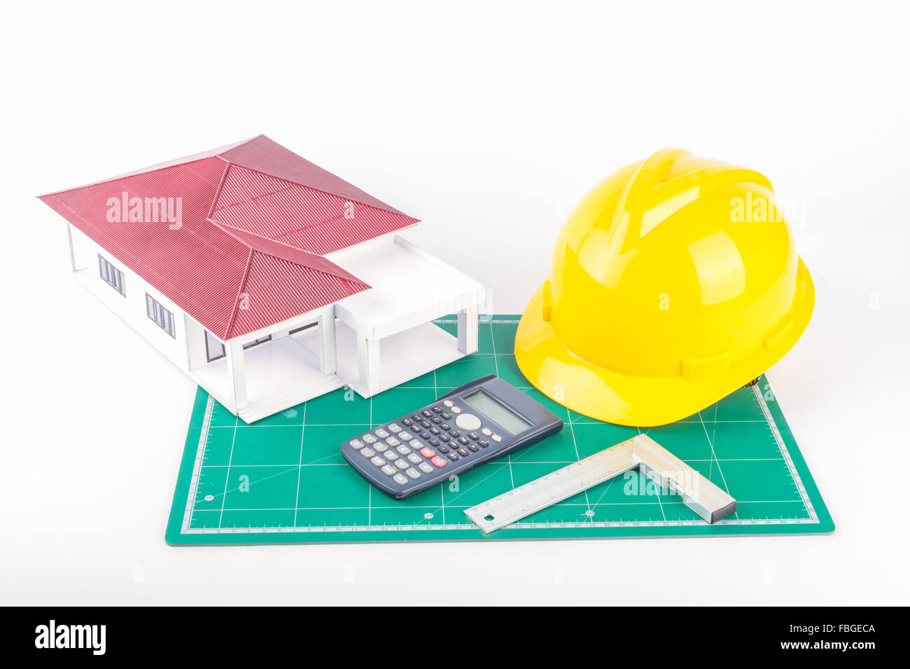 Model of the house and  calculator, Plastic right angle on white background Stock Photo