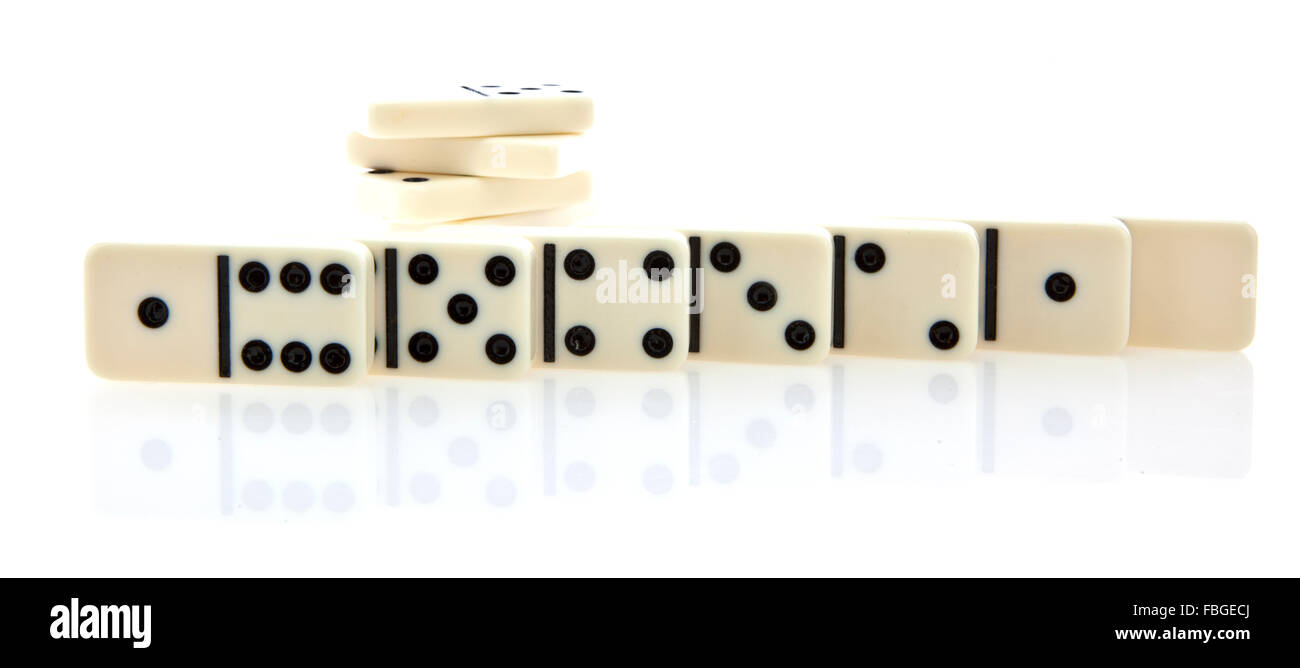 Row of white dominoes isolated on white background Stock Photo