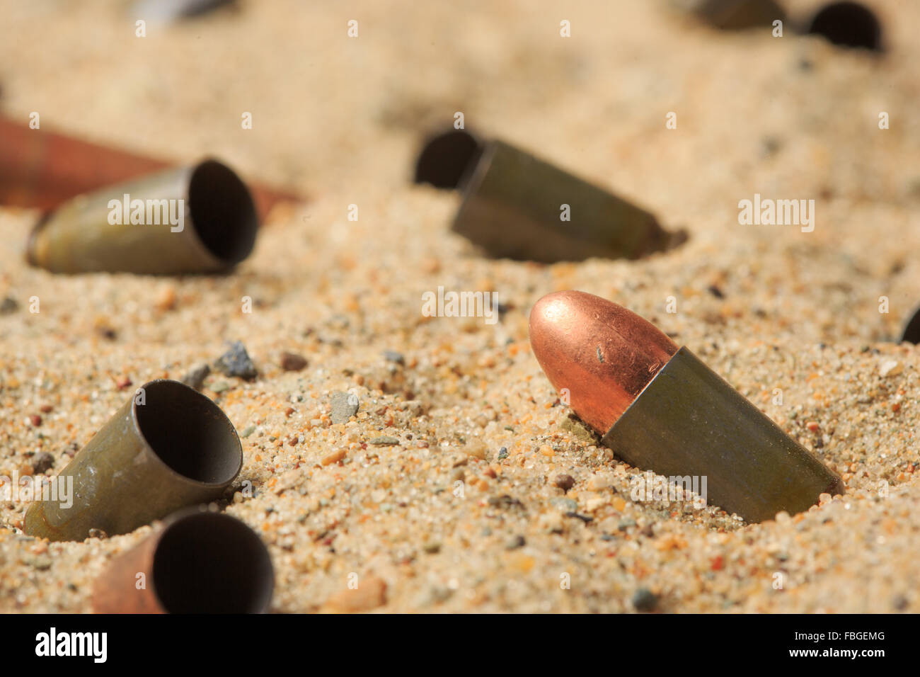 cartridge cases on the sand. Stock Photo