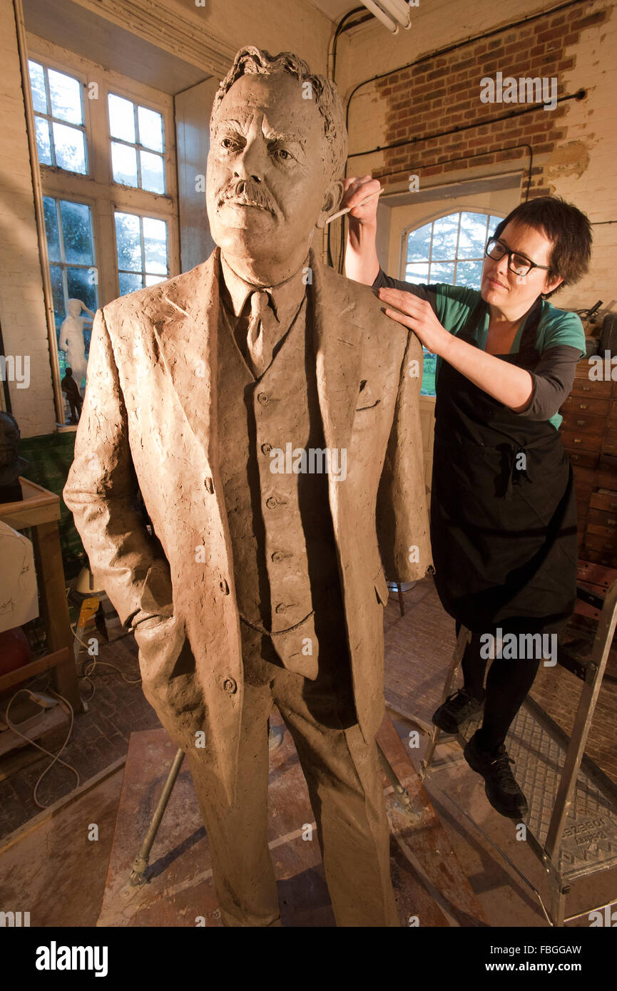 Sculptor Hazel Reeves works on the statue of Sir Nigel Gresley, the designer of the Flying Scotsman, for Kings Cross Station. Stock Photo