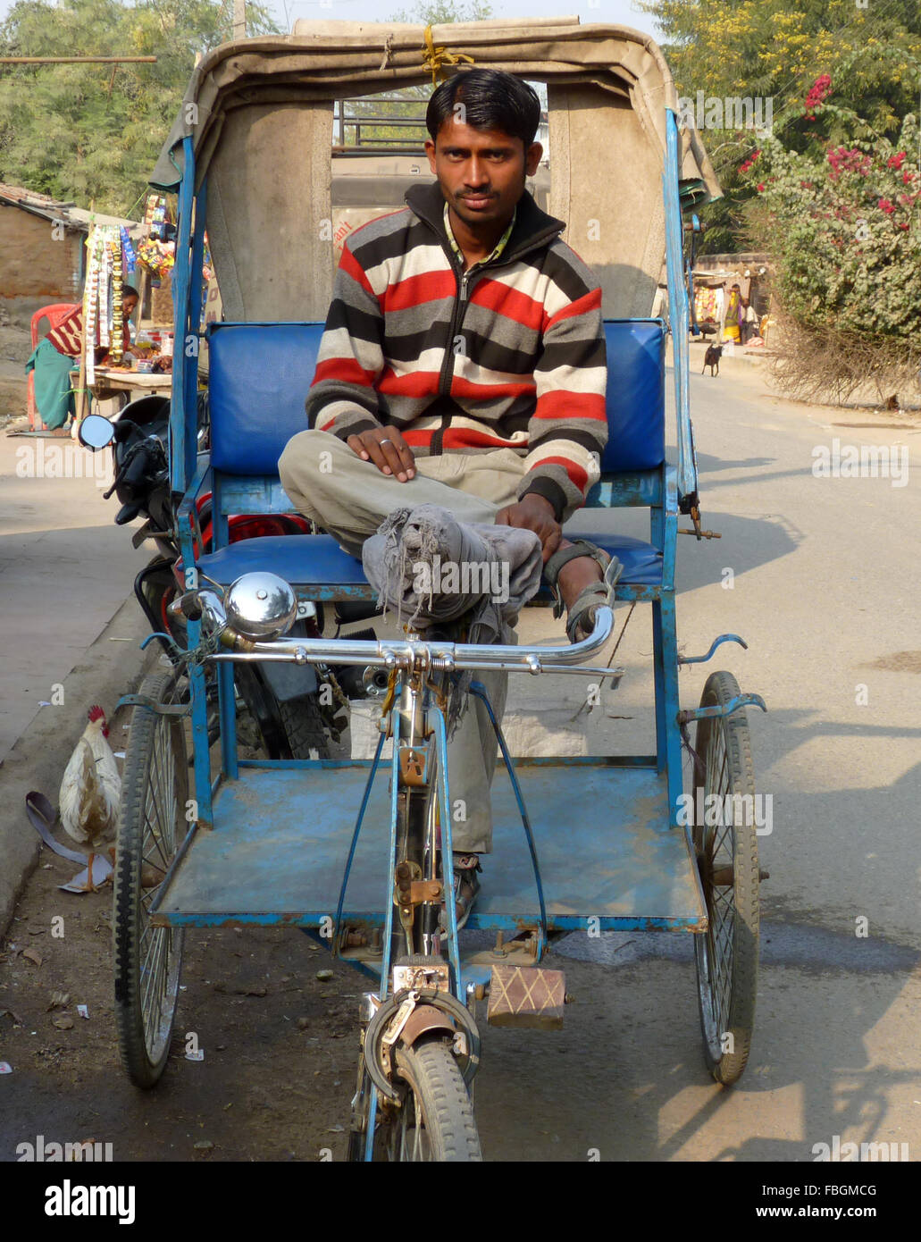 A Rickshaw Puller Sitting on His Rickshaw Stock Photo Alamy