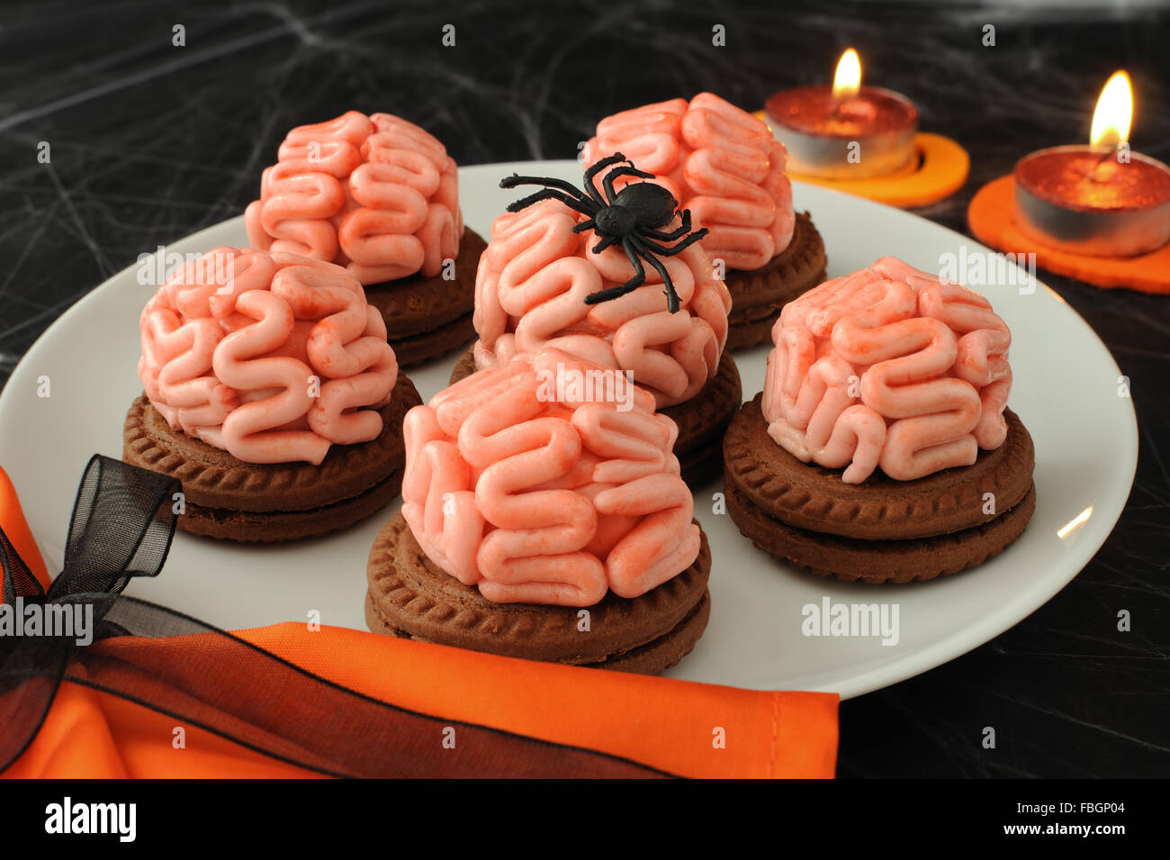 Funny cookie with brains of marzipan on Halloween Stock Photo