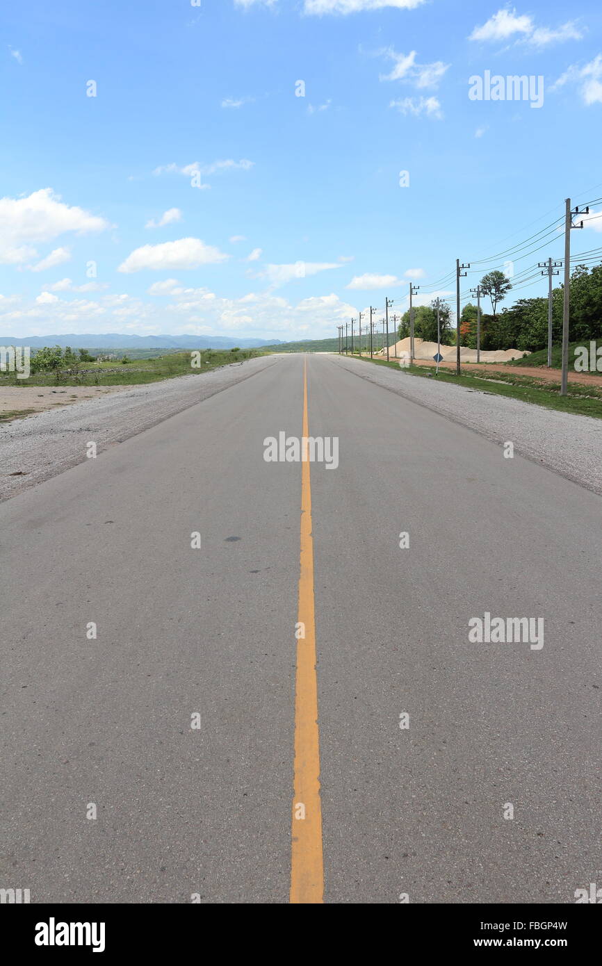 asphalt road against a blue sky Stock Photo