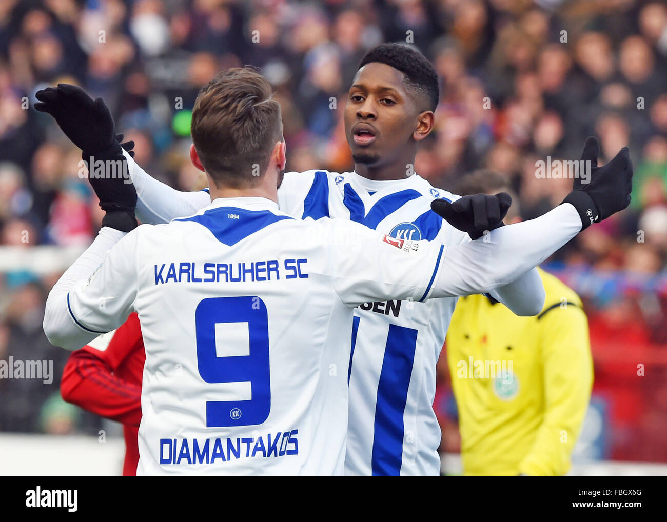 Karlsruhe, Germany. 16th Jan, 2016. Karlsruhe's Boubacar Barry (R) celebrates his 1-0 goal with Dimitris Diamantakos during the test match between Karlsruher SC and FC Bayern Munich in Wildpark Stadium in Karlsruhe, Germany, 16 January 2016. Munich's goalkeeper Manuel Neuer stands to the right. Photo: ULI DECK/dpa/Alamy Live News Stock Photo