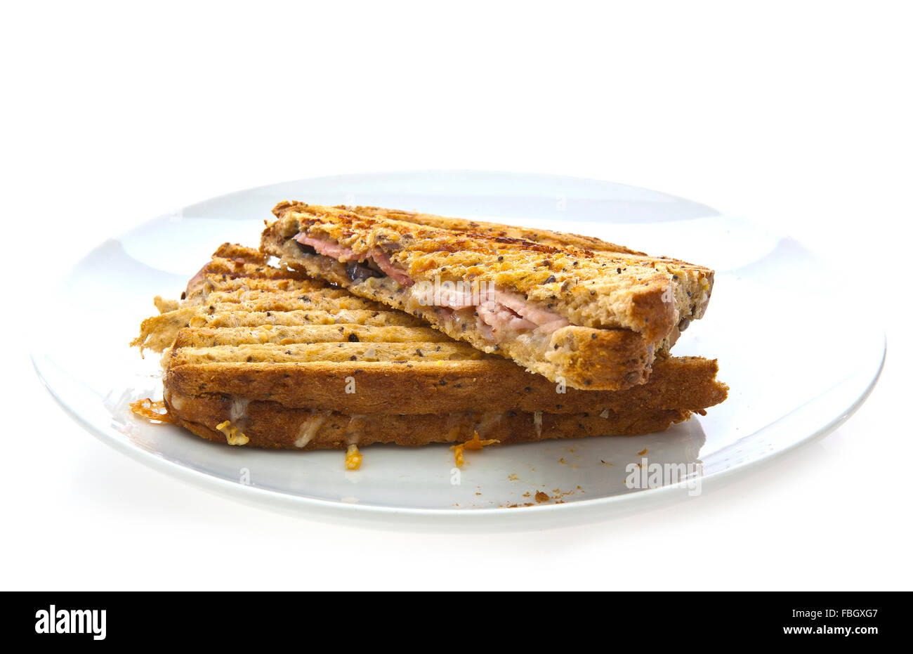 Toasted Cheese and Ham Sandwich on a white background Stock Photo