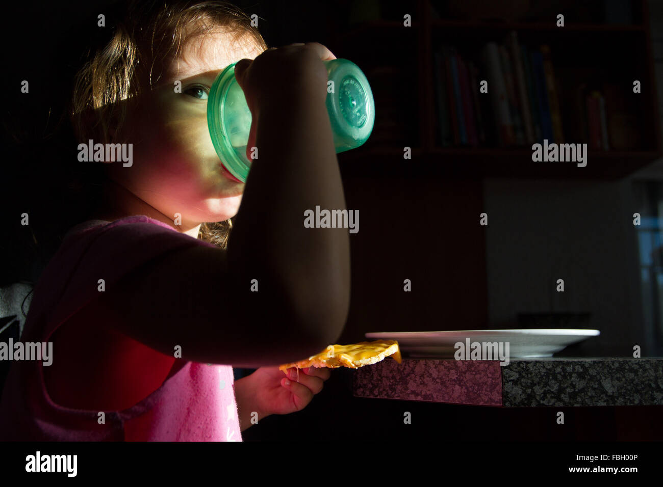 Toddler girl drinking from a plastic cup Stock Photo Alamy
