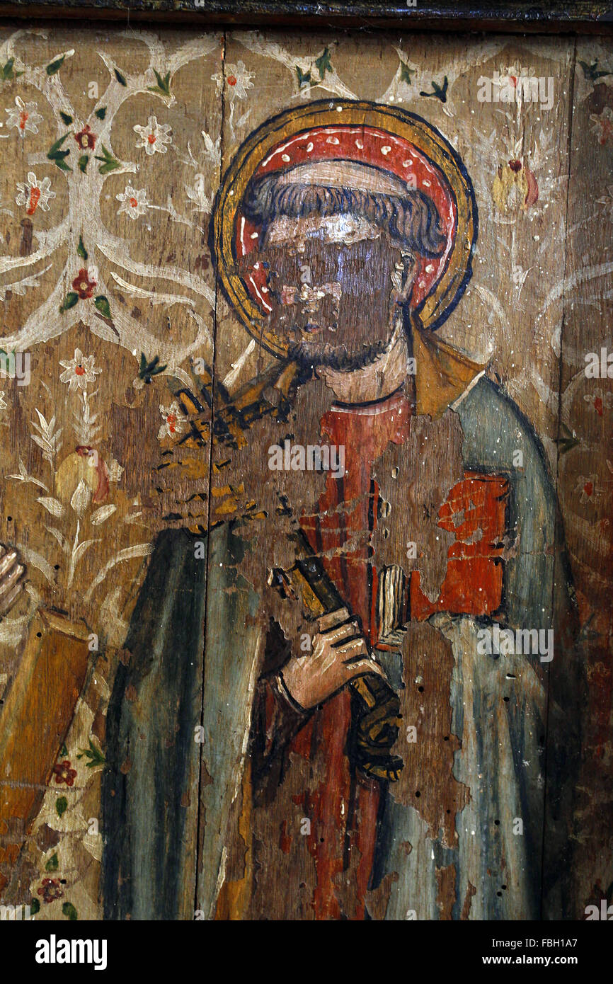 Painted Saint on the Rood Screen, St Peter holding Keys, much defaced by iconoclasts, St Michael's Church, Irstead, Norfolk Stock Photo