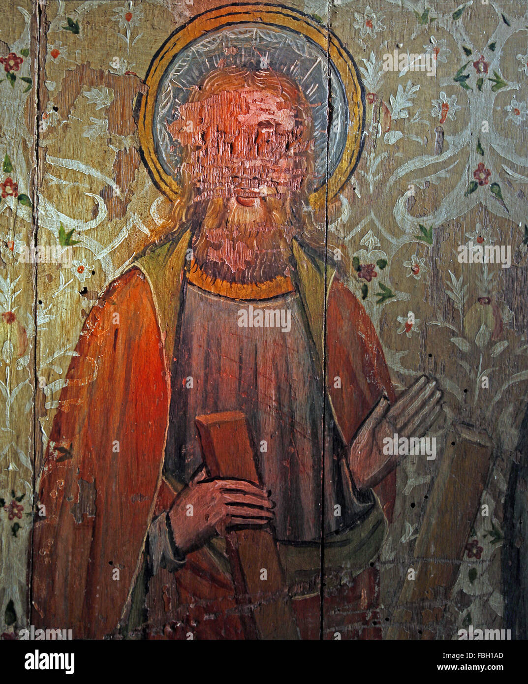 Painted Saint on the Rood Screen, St Andrew holding the saltire cross, St Michael's Church, Irstead, Norfolk Stock Photo