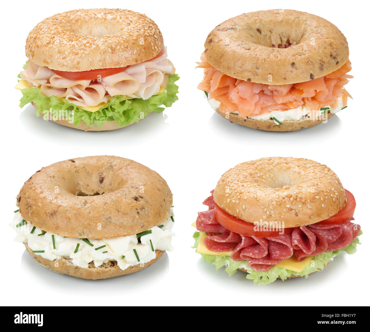 Collection of bagels with cream cheese, salmon, salami, tomatoes and