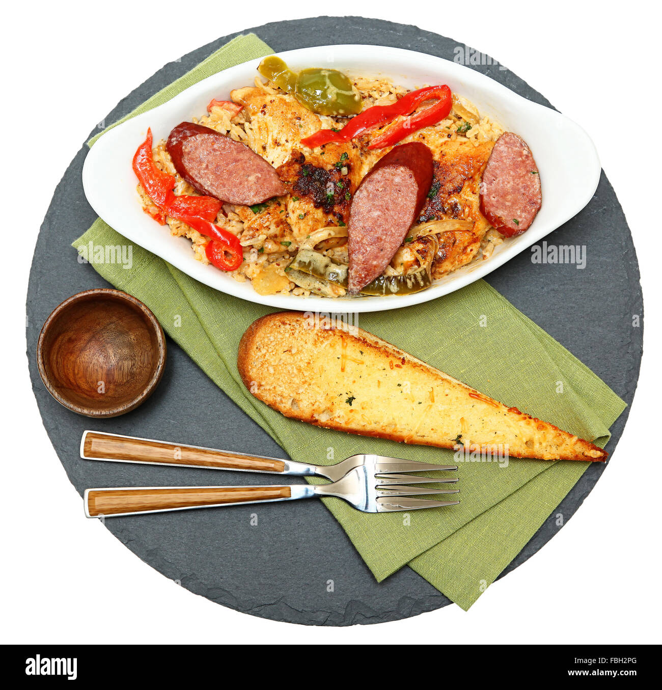 Voodoo Spicy Cajun Chicken and Sausage with Rice and Garlic Bread Stock Photo