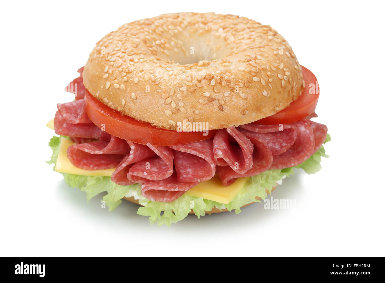 Bagel sandwich for breakfast with salami ham, cream cheese, tomatoes