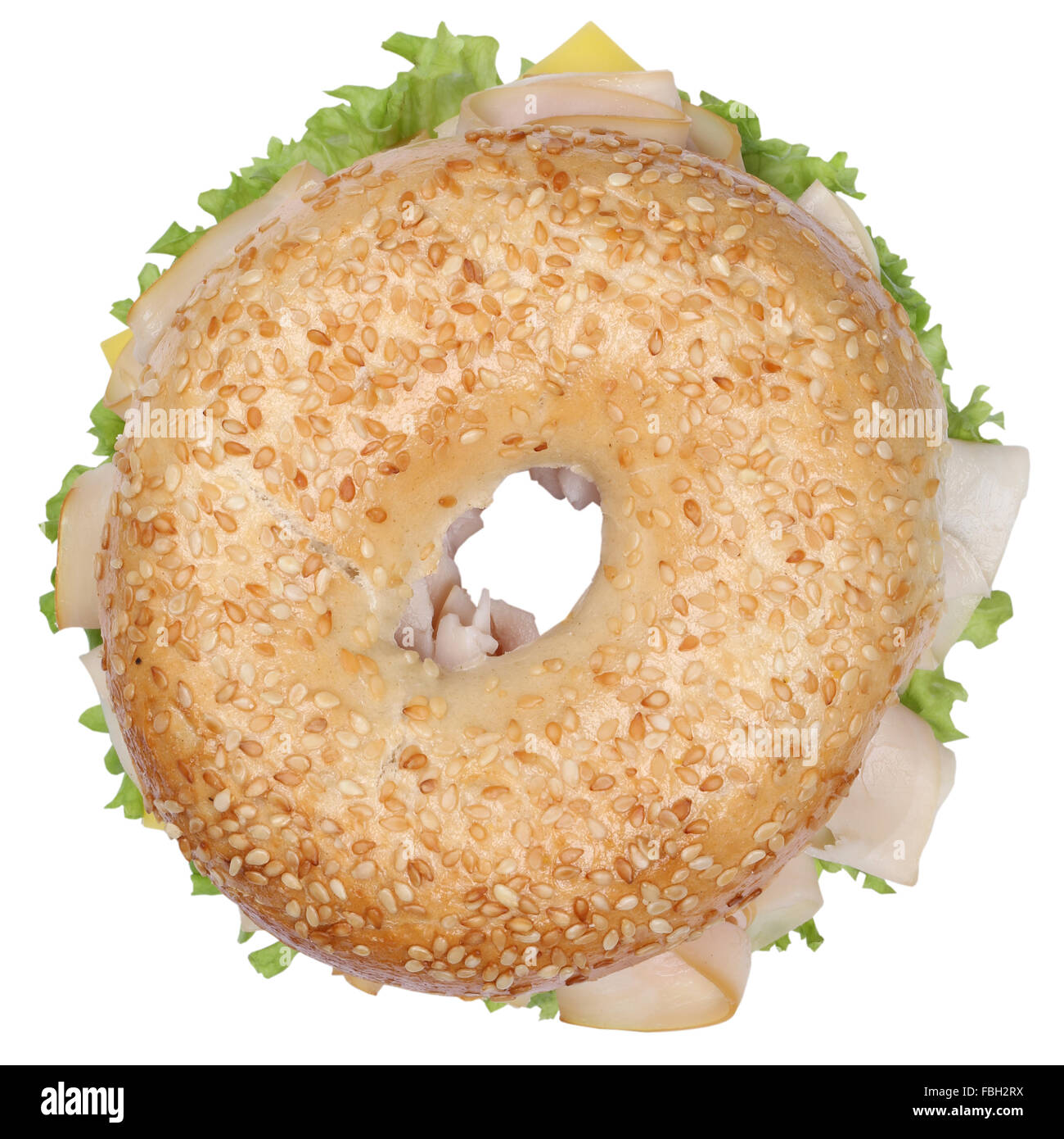 Bagel sandwich for breakfast with ham, cream cheese, tomatoes and