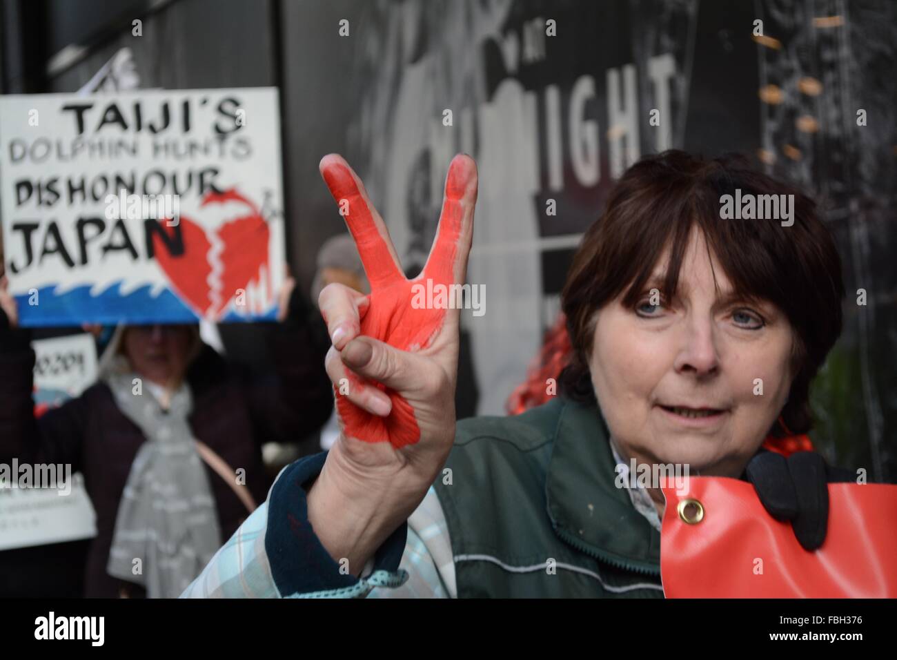 London, UK. 16th Jan, 2016. Protester holds a pease gesture as she marches down Oxford Street. She has red paint on her hands to symbolise blood. Credit:  Marc Ward/ Alamy Live News Stock Photo