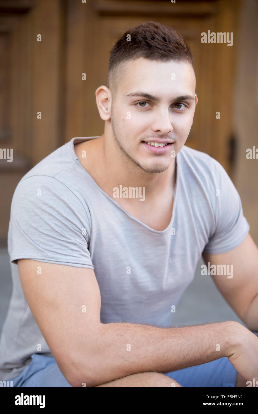 Portrait of hot guy looking in camera with a smile, wearing casual Stock  Photo - Alamy