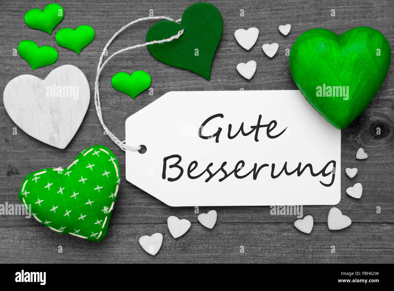 Label With Green Hearts, Gute Besserung Means Get Well Soon Stock Photo