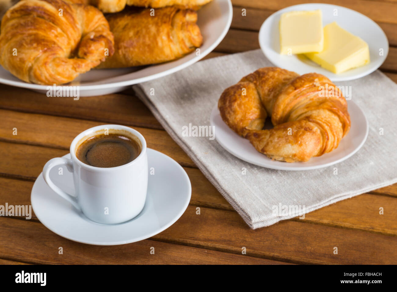 Croissants with butter and coffee Stock Photo