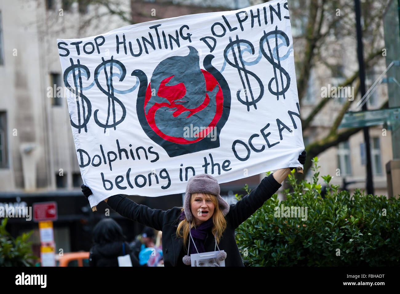 London, 16 January 2016. Animal rights activists with a banner protesting in London against the slaughter of dolphins in Taiji Cove Credit:  Dinendra Haria/Alamy Live News Stock Photo