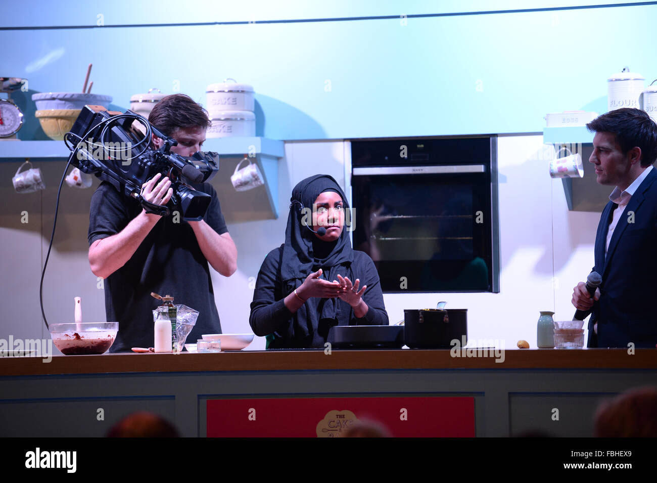 Nadiya Hussain, winner of The Great British Bake Off 2015 takes part in a cookery demonstration at the Cake and Bake Show. Stock Photo