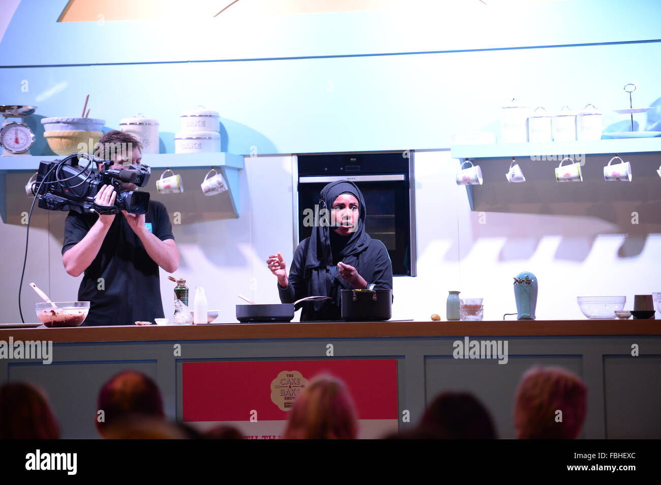 Nadiya Hussain, winner of The Great British Bake Off 2015 takes part in a cookery demonstration at the Cake and Bake Show. Stock Photo