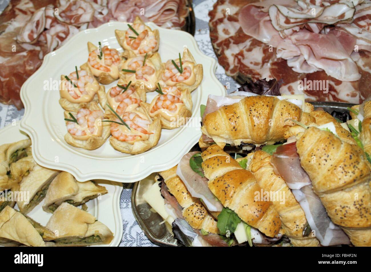 table laid with various dishes of appetizers Stock Photo