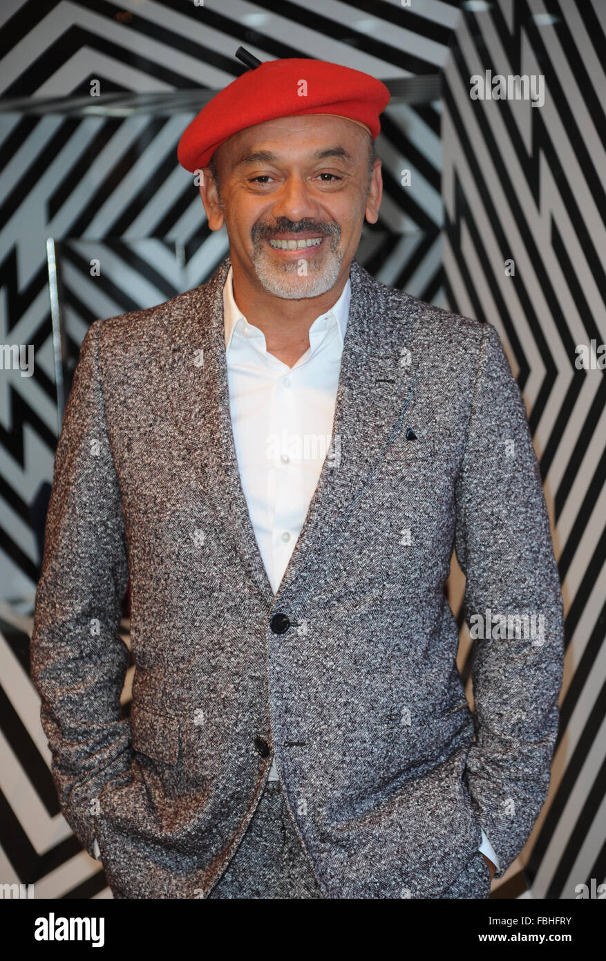 Shoe Designer Christian Louboutin launches new boutique selling his trademark red-soled shoes inside Selfridges,Manchester. Stock Photo