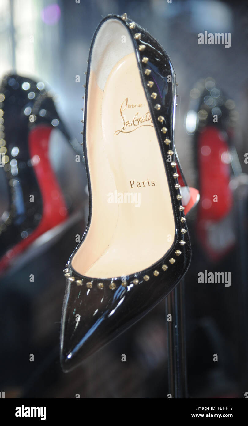 Shoe Designer Christian Louboutin launches new boutique selling his  trademark red-soled shoes inside Selfridges,Manchester Stock Photo - Alamy