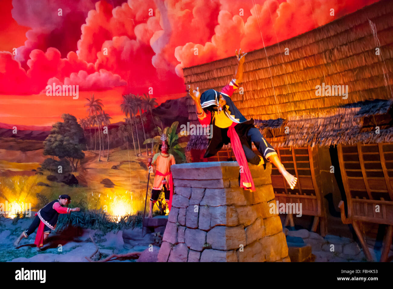 A diorama in Taman Mini Indonesia Indah showing people in traditional stone jump ceremony in Nias Island. Stock Photo