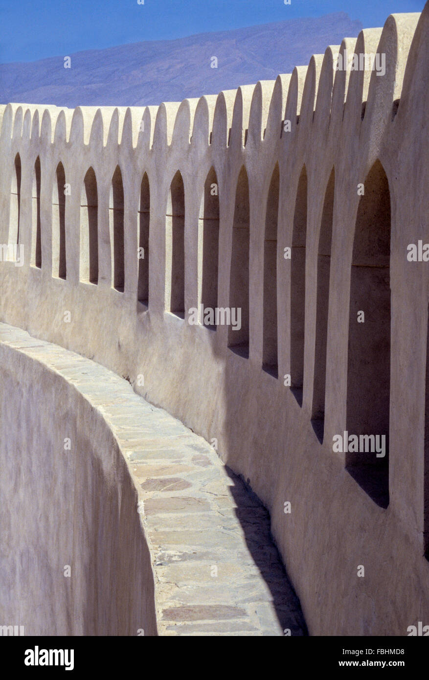 Nizwa, Oman.  Parapet Circling the Fort's Inner Courtyard, Windows Opening to the Surrounding Countryside. Stock Photo