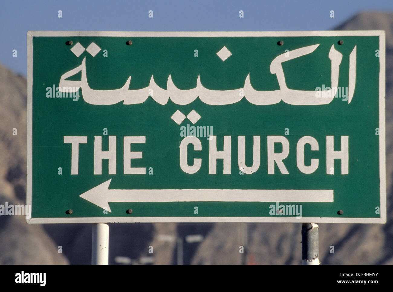 Muscat, Oman.  Sign Pointing to a Church in a Residential Suburb of the Muscat Capital Area. Stock Photo