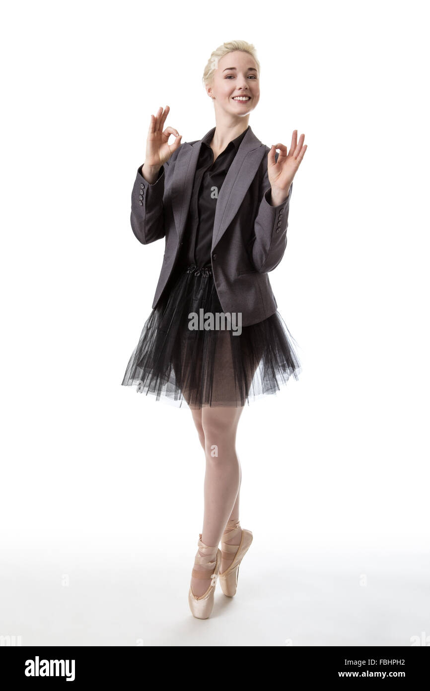 Model in a ballerina tutu, making the ok hand gesture with both hands Stock Photo