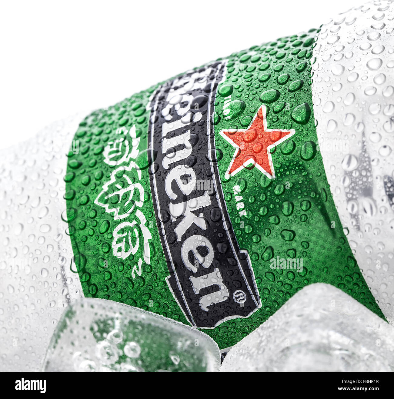Cold can of Heineken Beer on ice over a white background Stock Photo