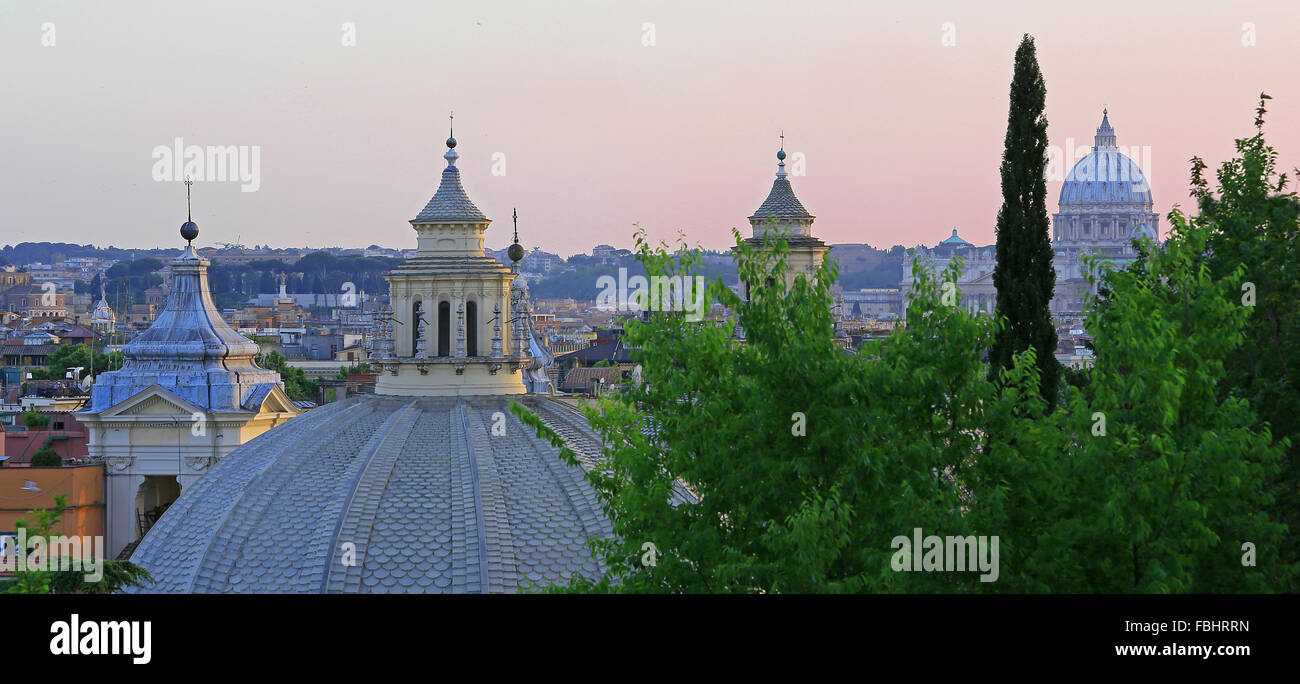 Domes of Santa Maria Churches (and St Peter's Basilica in background) at dusk, Rome, Italy. View from Pinicio Hill Gardens. Stock Photo