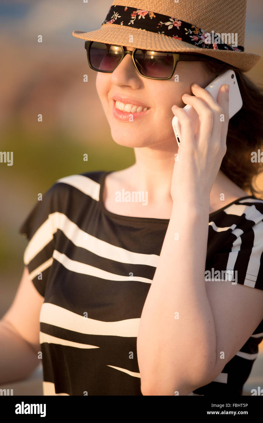 Portrait of young Caucasian happy smiling woman in cute straw hat ...