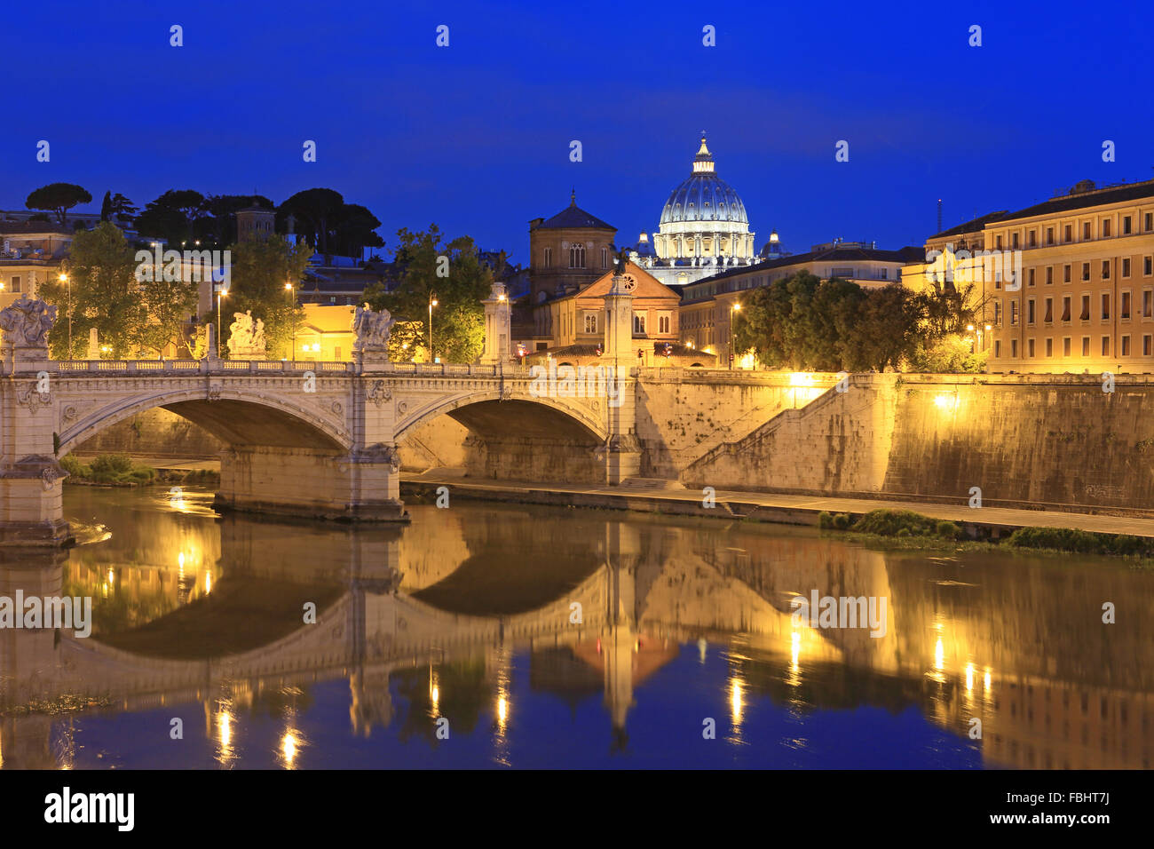 Sant'Angelo Bridge over River Tiber and St Peter's Basilica at dawn, Rome, Italy. Stock Photo