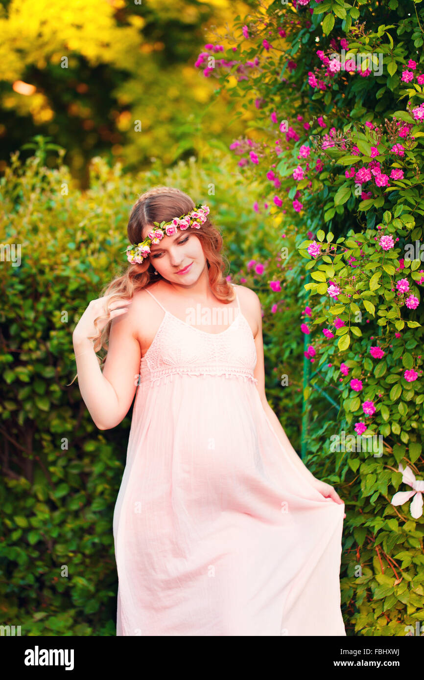 Beautiful pregnant woman relaxing outside in the park Stock Photo - Alamy
