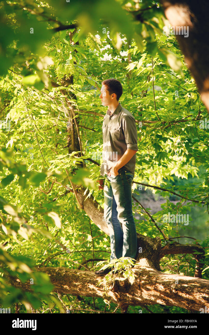 Portrait of a young man on nature in the grass Stock Photo - Alamy