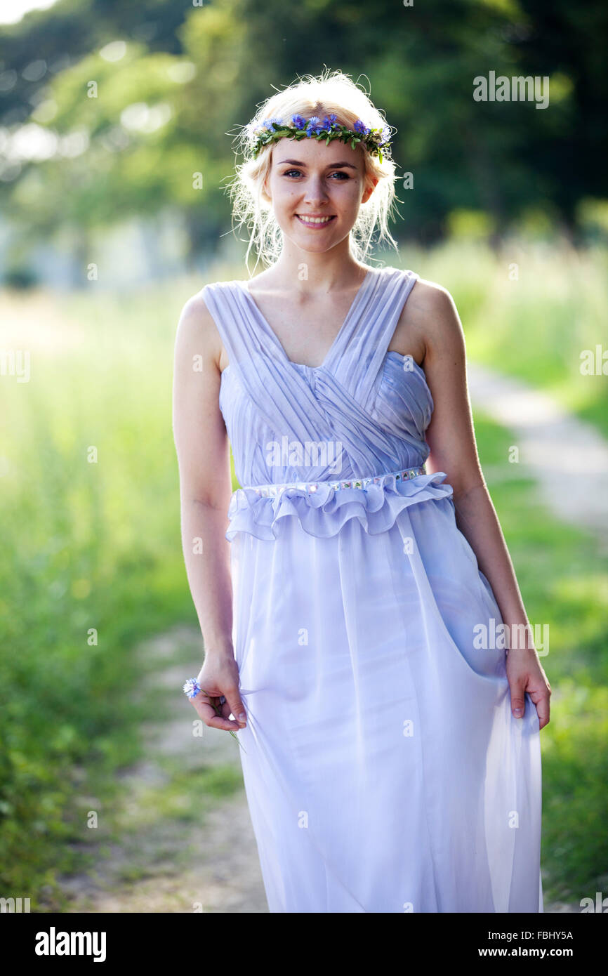 young woman dancing in summer dress in nature Stock Photo - Alamy