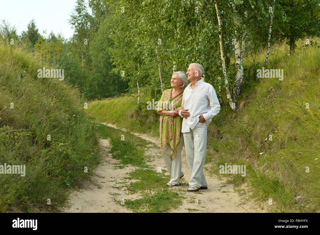 Portrait of senior couple in forest Stock Photo - Alamy