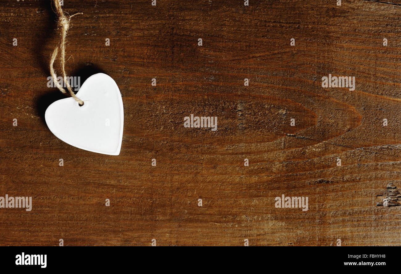 white heart on a vintage wooden background - love concept Stock Photo ...