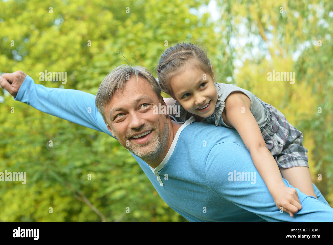 father with daughter in summer park Stock Photo - Alamy
