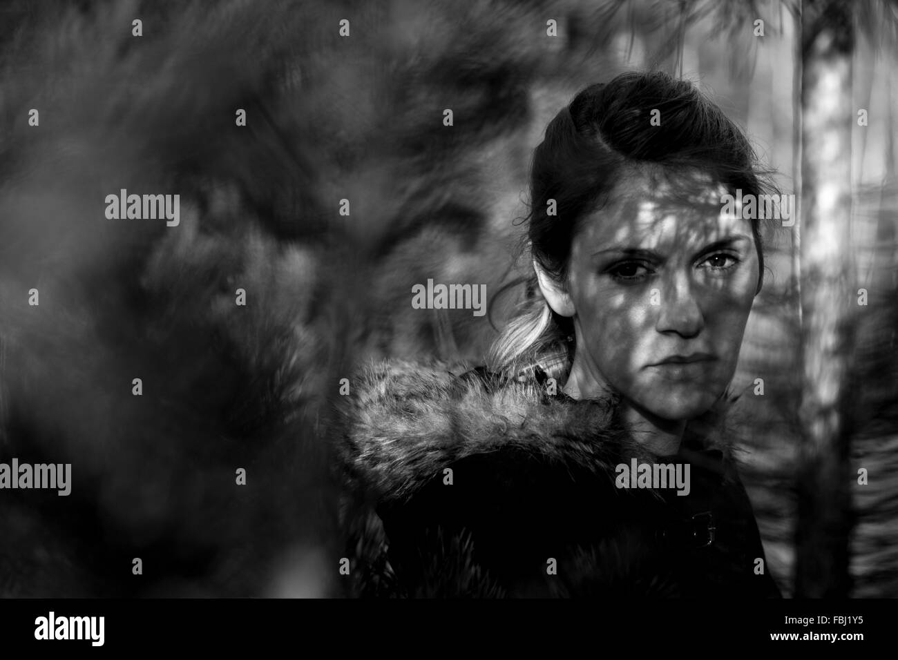 Portrait of a young woman in the forest Stock Photo - Alamy