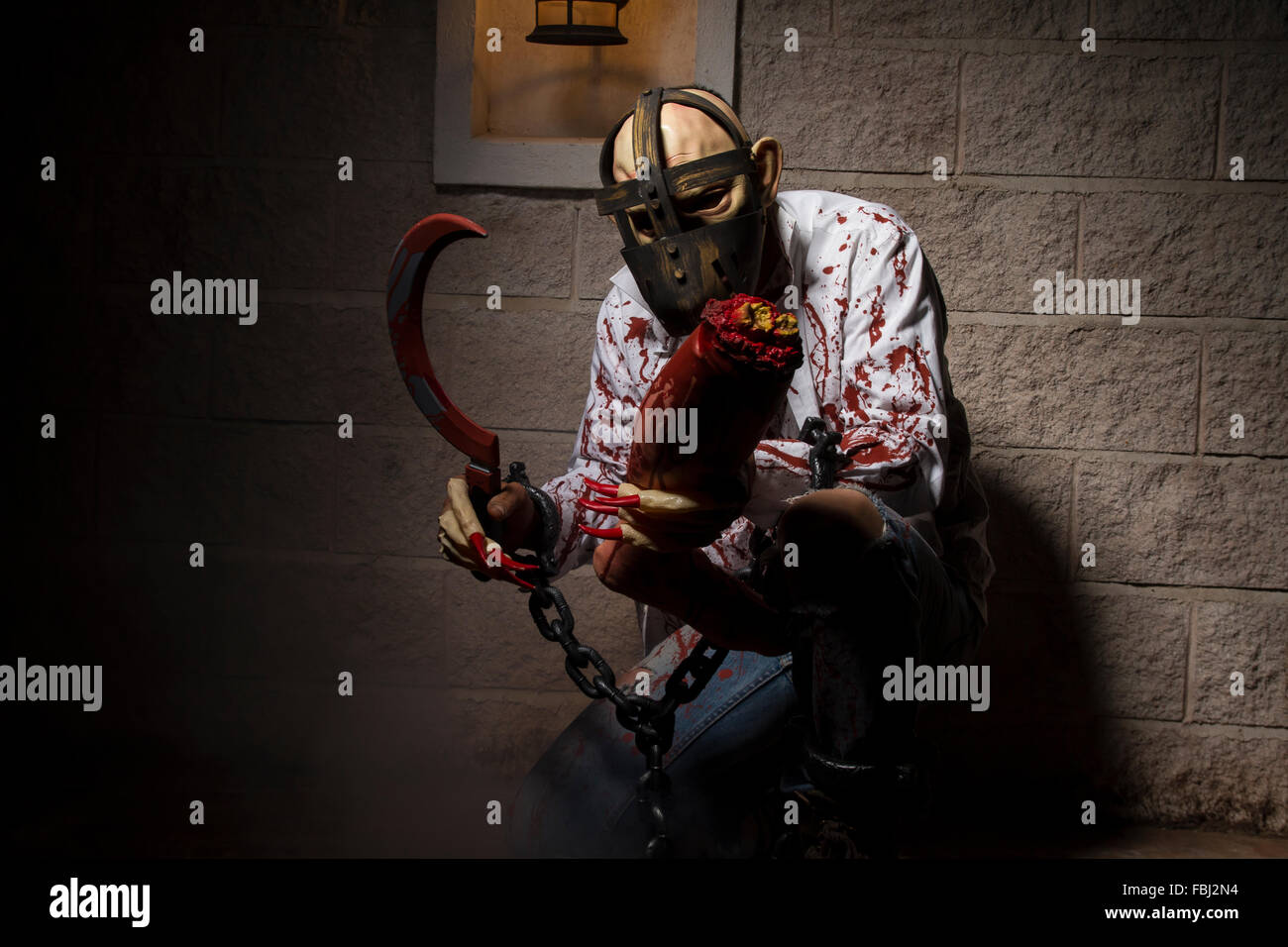 dead, halloween monster chained with bloody hook, night scene and terror Stock Photo