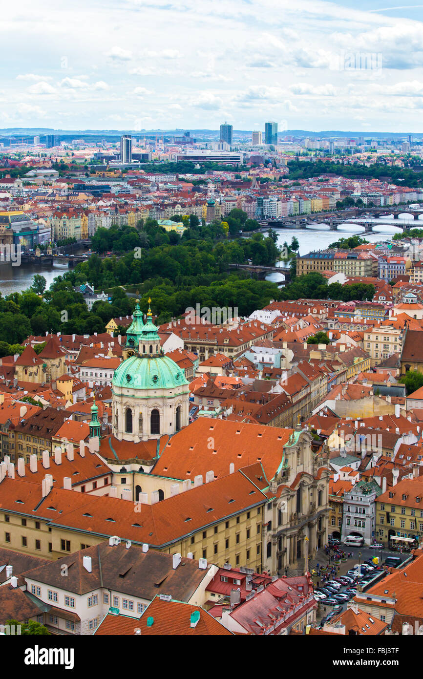 Tourism and sightseeing, view from above over Prague cityscape. Green dome of St Nicholas Church in Malostranské náměstí Good we Stock Photo