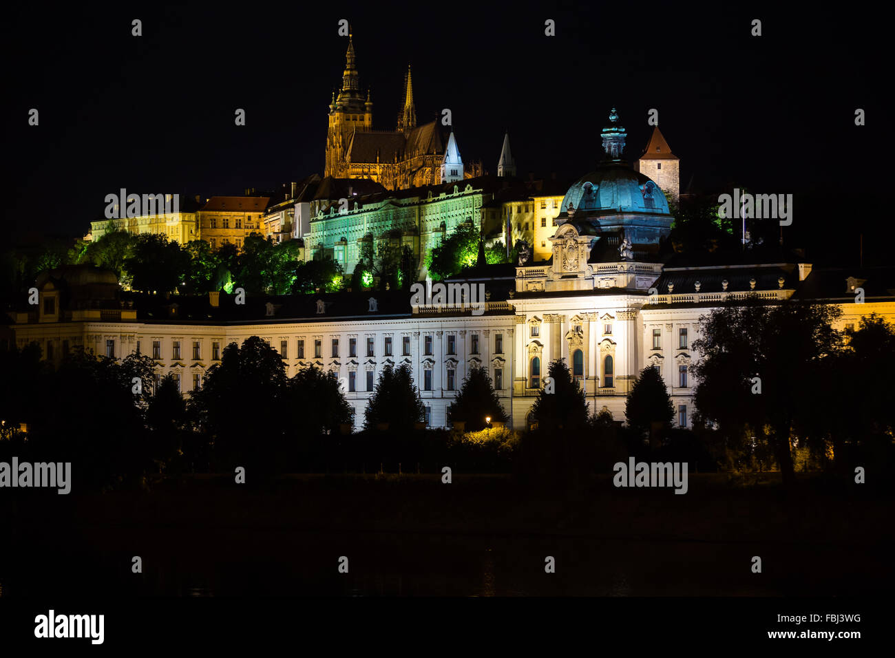Tourism and sightseeing. Night landscape of Prague, illuminated architecture, St. Vitus Cathedral in the distance. View on Pragu Stock Photo