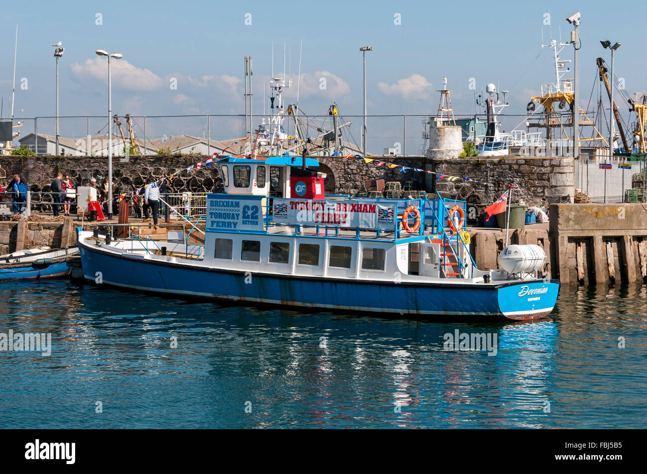 Passengers waiting on the quayside at Brixham to board the empty ferry