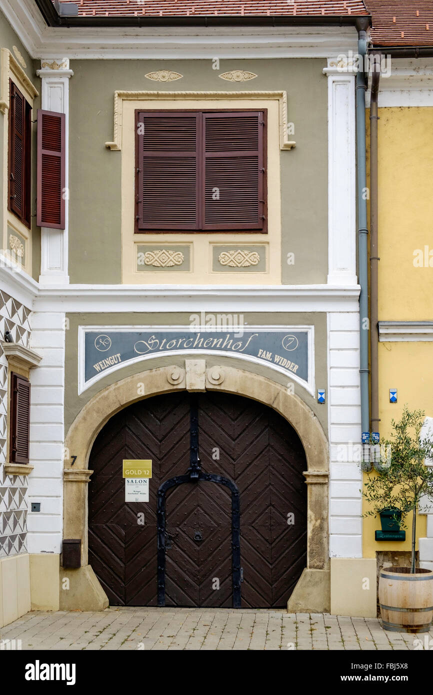 Front of building in small town of Rust, Burgenland Austria. Europe. Building has ached doorway with wooden door and decoration Stock Photo