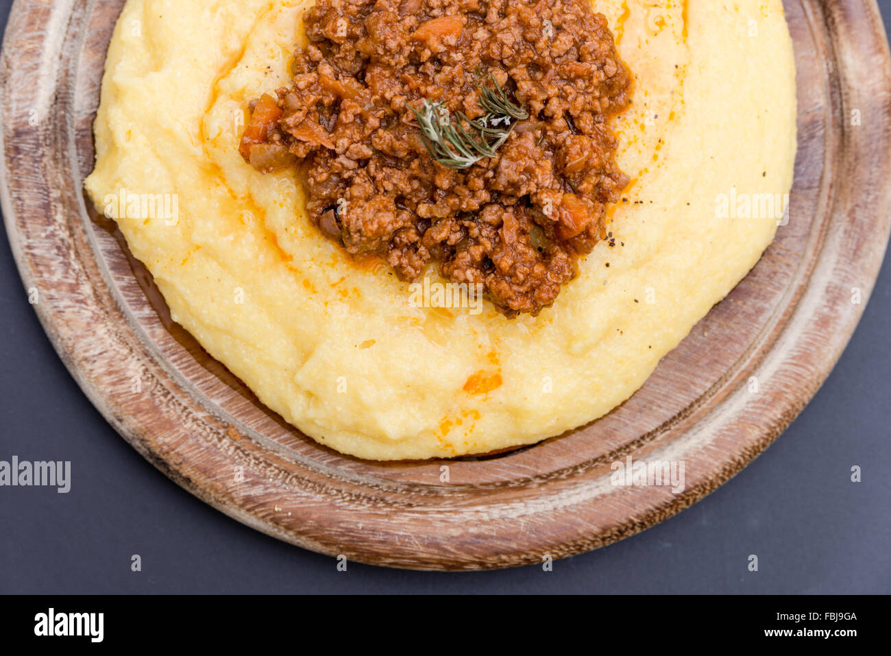 A close up view of a traditional italian dish Polenta with bolognese